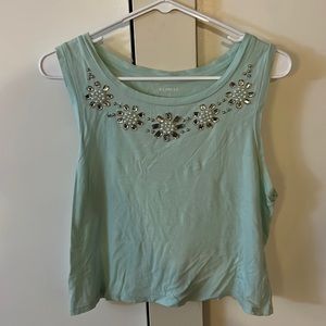 Light green Express top, with flower beading on top